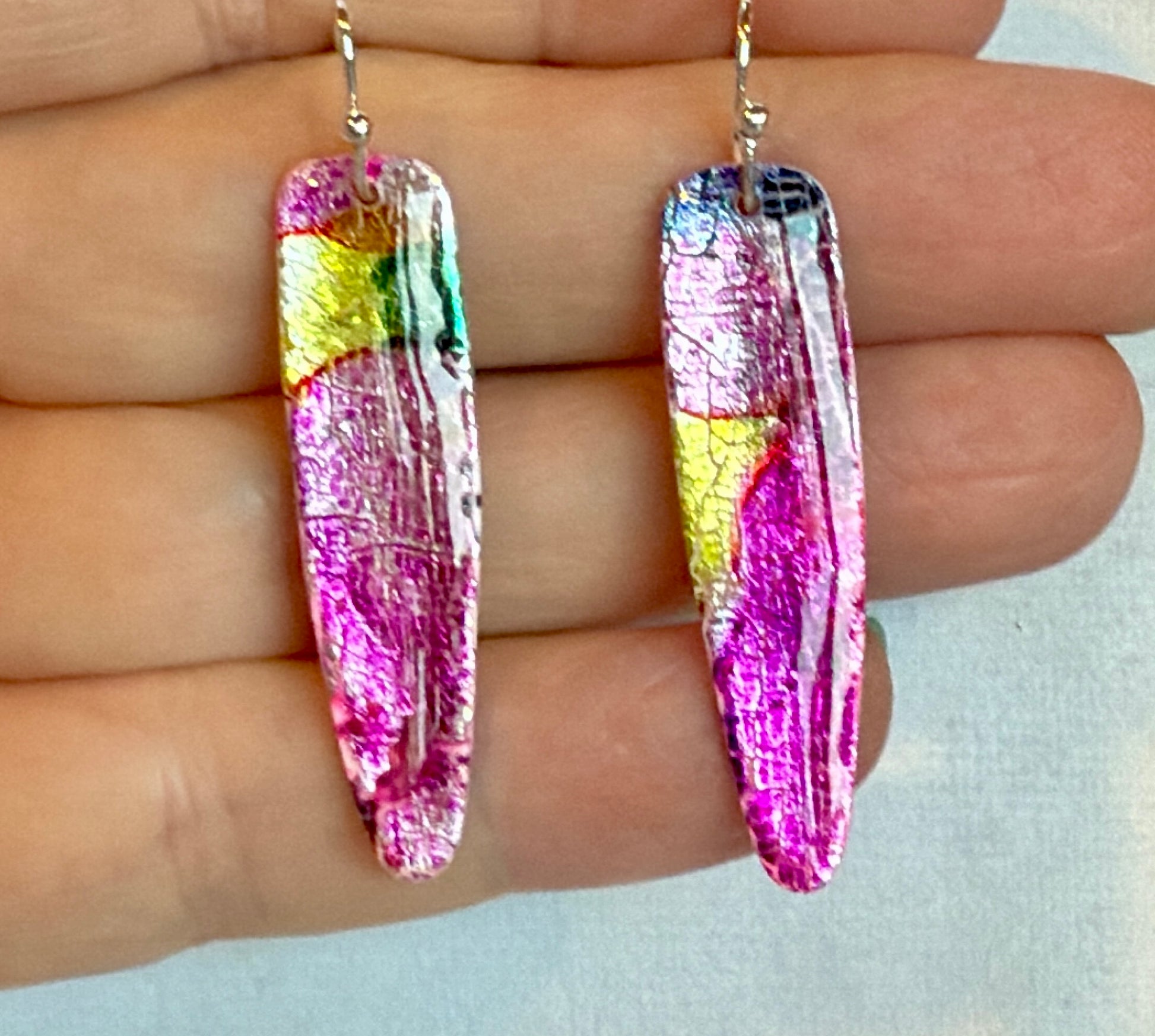 Polymer Clay dangles on hypoallergic wires. Sparkle and shine with silver leaf and inks